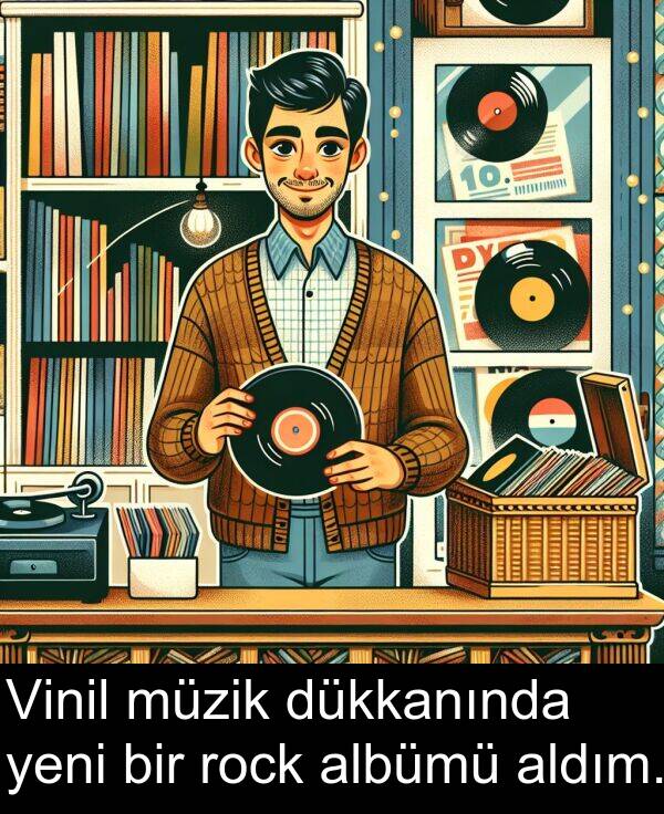 rock: Vinil müzik dükkanında yeni bir rock albümü aldım.