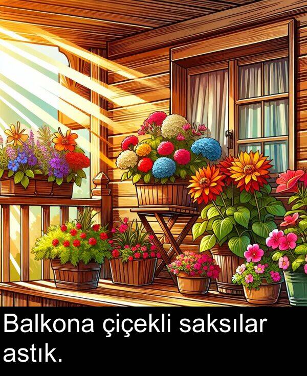 astık: Balkona çiçekli saksılar astık.