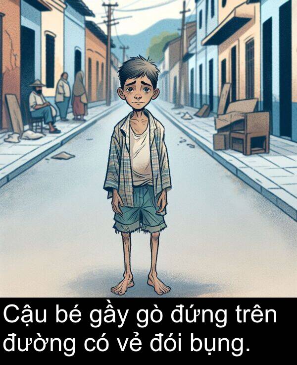 đói: Cậu bé gầy gò đứng trên đường có vẻ đói bụng.