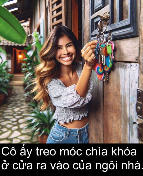 móc: Cô ấy treo móc chìa khóa ở cửa ra vào của ngôi nhà.