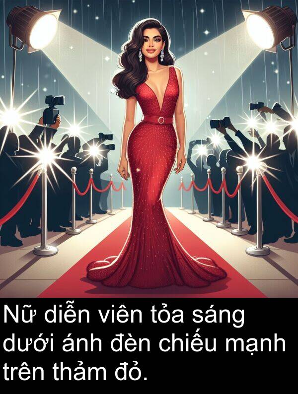 đỏ: Nữ diễn viên tỏa sáng dưới ánh đèn chiếu mạnh trên thảm đỏ.