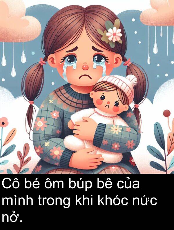 búp: Cô bé ôm búp bê của mình trong khi khóc nức nở.