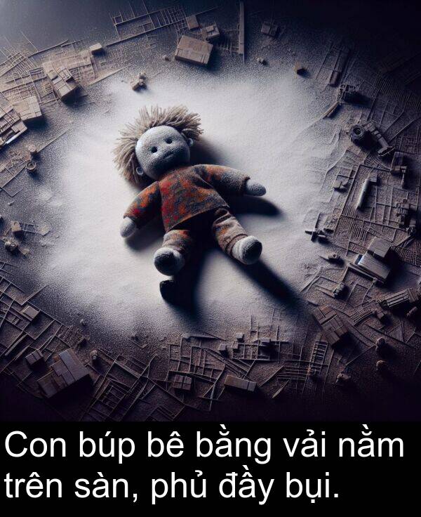 đầy: Con búp bê bằng vải nằm trên sàn, phủ đầy bụi.