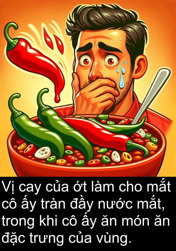 cay: Vị cay của ớt làm cho mắt cô ấy tràn đầy nước mắt, trong khi cô ấy ăn món ăn đặc trưng của vùng.