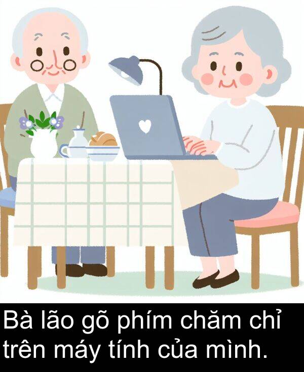 chăm: Bà lão gõ phím chăm chỉ trên máy tính của mình.