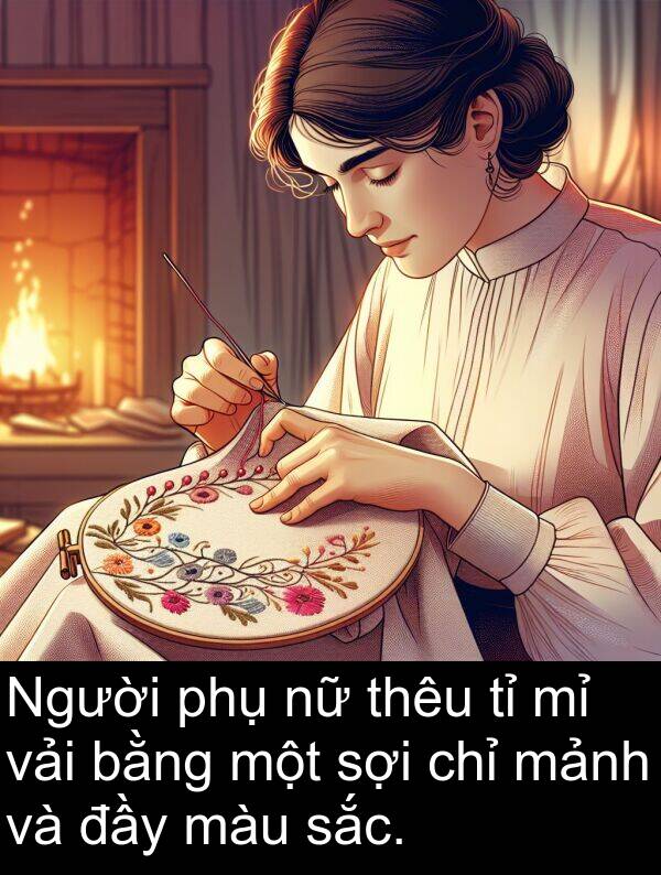 vải: Người phụ nữ thêu tỉ mỉ vải bằng một sợi chỉ mảnh và đầy màu sắc.