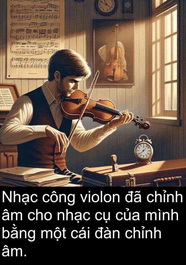 đàn: Nhạc công violon đã chỉnh âm cho nhạc cụ của mình bằng một cái đàn chỉnh âm.